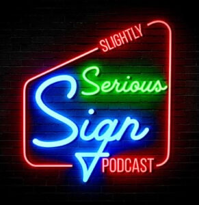 Neon sign reading "Slightly Serious Sign Podcast" in red, green, and blue text on a black brick wall background, perfect for fans of Onyx Graphics and cutting-edge RIP software.